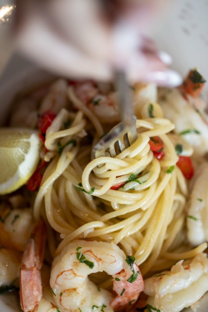 Fork twirling fresh seafood spaghetti with prawns at Bianco Italian Restaurant Caloundra