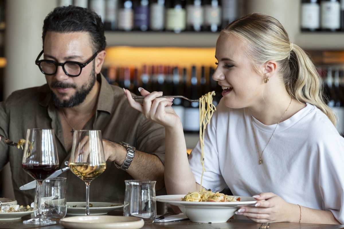 Couple enjoying pasta and wine at Bianco Italian Restaurant Caloundra