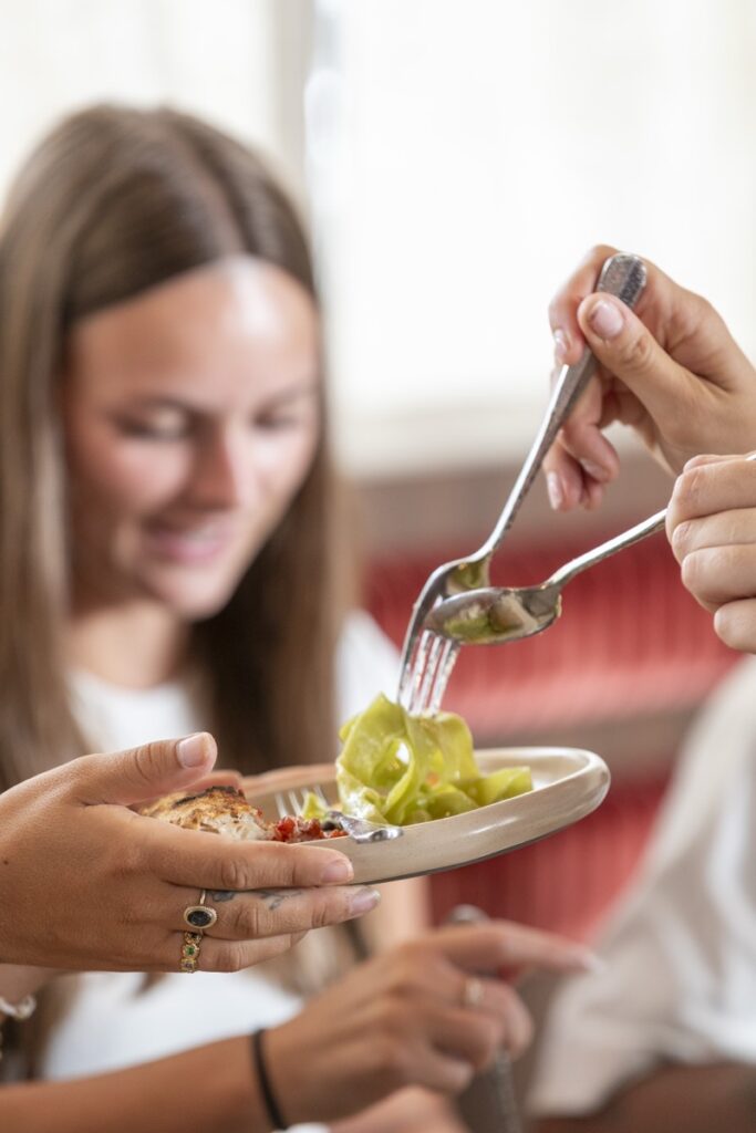 Guest being served fresh Italian entrée at Bianco Italian Restaurant Caloundra